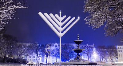 Snow covered giant menorah in Victoria Gardens on the Old Steine, Brighton, East Sussex, England.