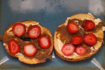 Apple butter and strawberries on a bagel