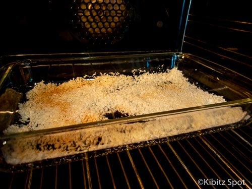 Coconut toasting in the oven, the first step of our gluten-free macaroon recipe