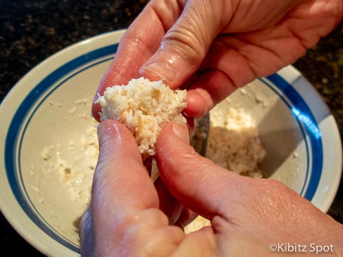 Forming the balls from dough for homemade macaroons