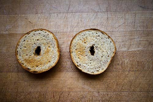 Toasted plain bagel cut in half