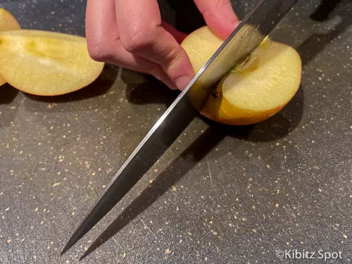 Slicing apples to is the first step to making our gluten free apple crumble