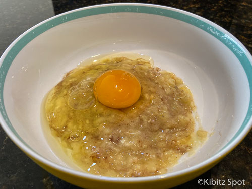 Mixing banana with eggs to create fluffy gluten free pancakes