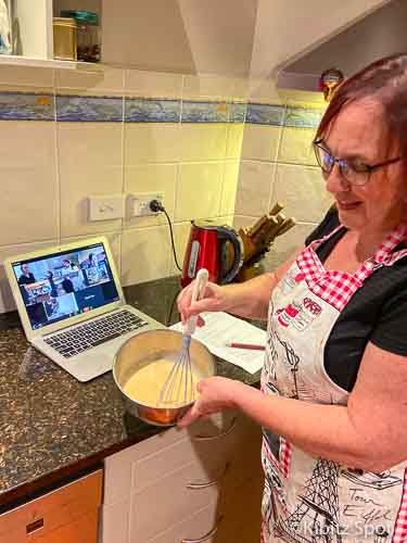 Kaya Recipe: Making Coconut Jam with an Online Cultural Cooking Class 5 Mixing the kaya ingredients to make a coconut jam while the live class is on the computer in the background