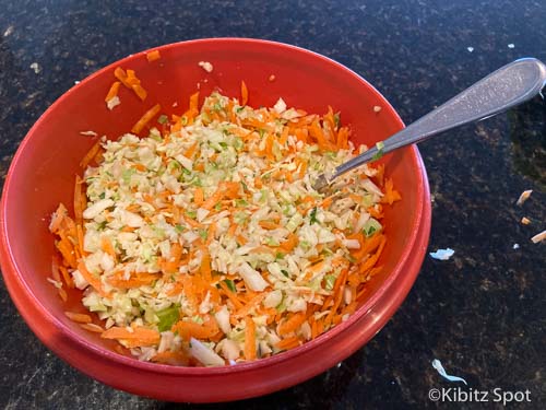 Add carrots and cabbage to homemade coleslaw dressing