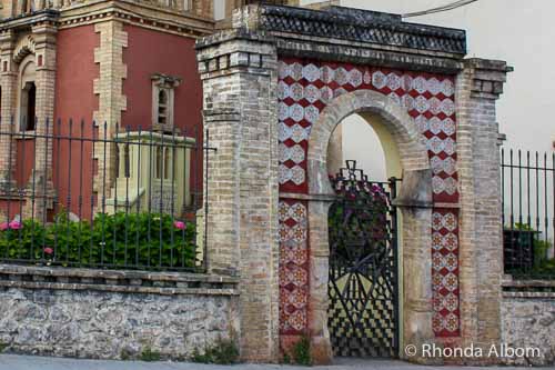 A gate with Jewish star patterns in the tiles in front of a house in Comillas Spain