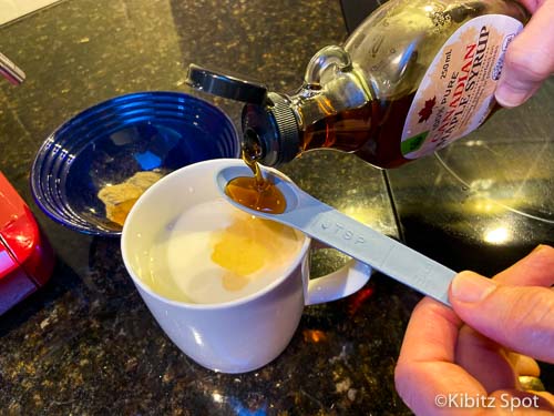 Adding maple syrup to almond milk to make a turmeric latte