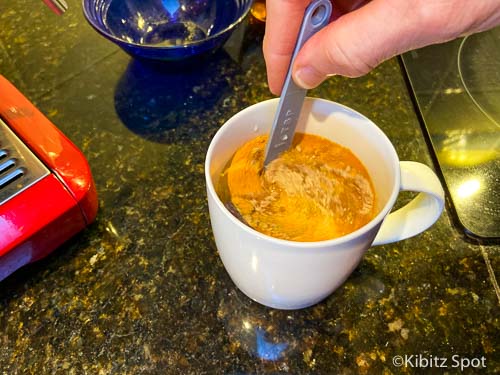 Stirring the ingredients to make a turmeric latte