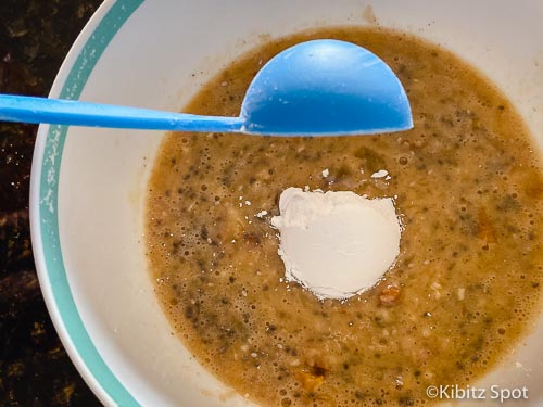 Adding flour to our banana chia muffins