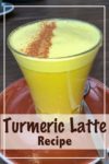 A freshly made turmeric latte with a sprinkle of cinnamon on top