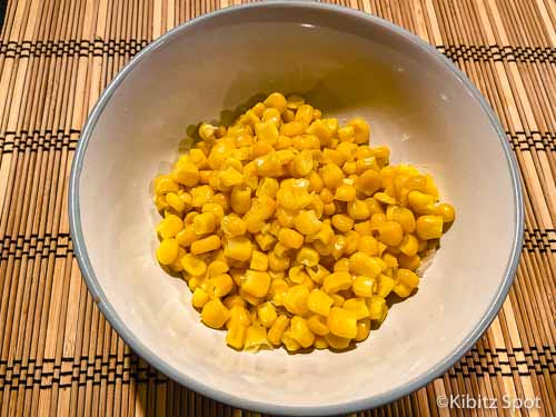 Corn kernels as one of the baked potato bar toppings