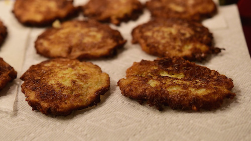 Freshly fried potato pancakes on paper towels