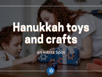 Child unwrapping Hanukkah toys