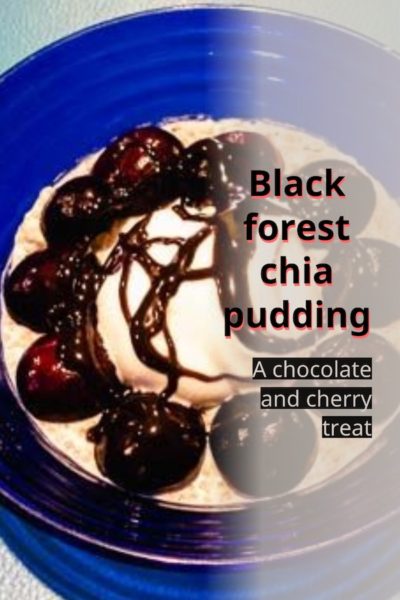 A bowl of black forest chia pudding with fresh cherries