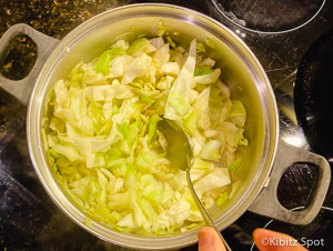 cabbage being stir-fried