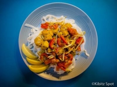 Malaysian fish curry served on a bed of rice noodles