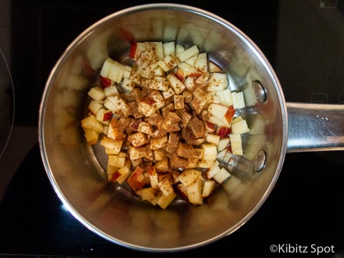 Apple and cinnamon simmering in water