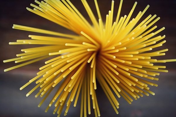 dry spaghetti in an expanded bunch