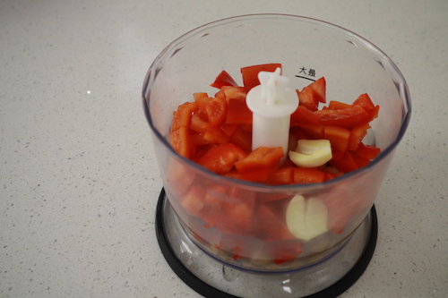 red peppers and garlic in a food processor