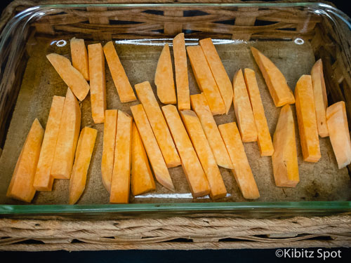 Chips in the pan ready to bake in the oven