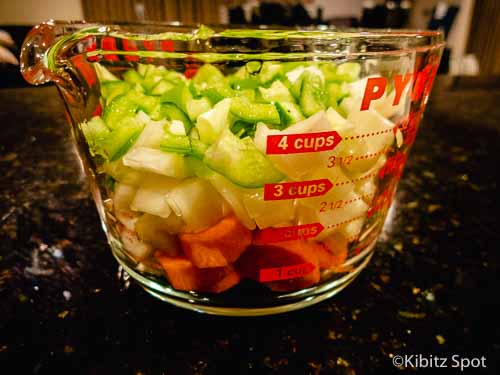 Chopped vegetables in a measuring cup