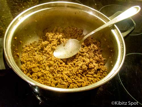 Ground beef browning in a stock pot