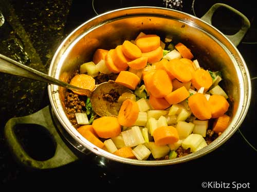 Vegetables being stirred into our our Tex-Mex chili con carne