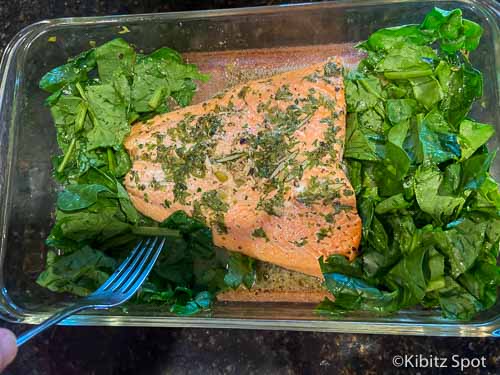 Spinach added to pan with salmon