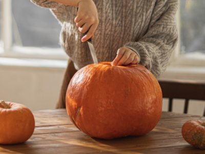 A knife inserted to show how to cut a pumpkin