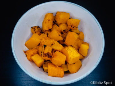 A bowl of roasted pumpkin cubes ready to eat