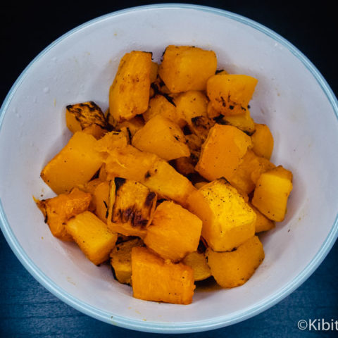 A bowl of roasted pumpkin cubes ready to eat
