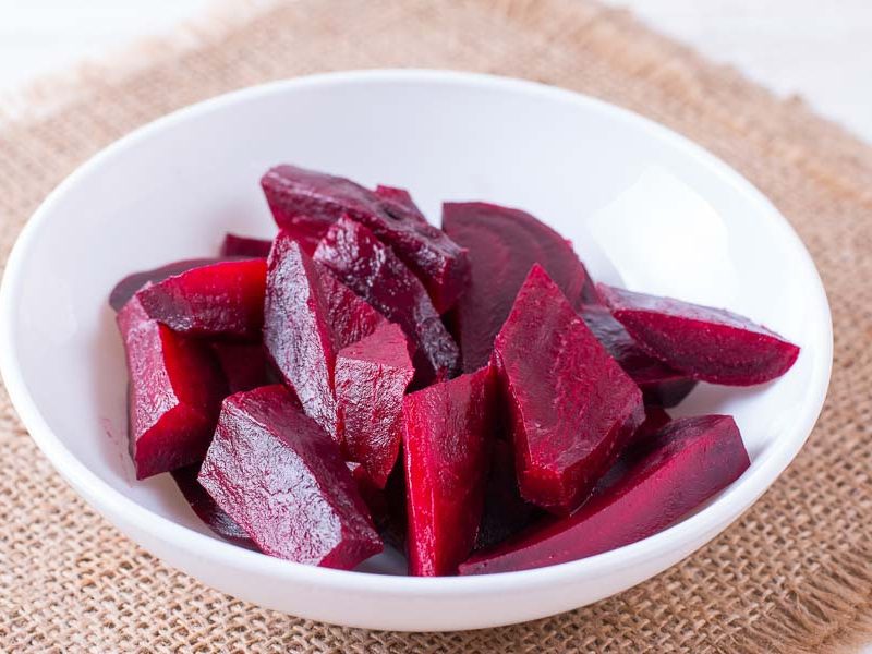 Steamed beets sliced and ready to serve in a bowl