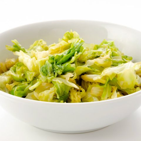 Easy Vegan Cabbage Stir Fry Recipe with 4 ingredients (gluten-free) 11 Our Vegan Cabbage Stir Fry in a white bowl