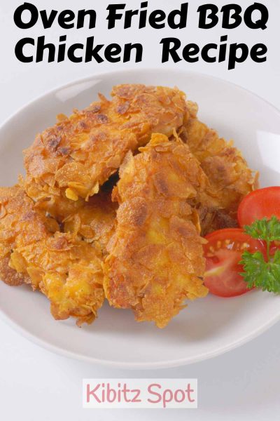 A 3-ingredient oven fried chicken on a plate. This healthy alternative to traditional fried chicken has a tangy bbq flavor. It's quick and easy and can be easily made gluten-free.