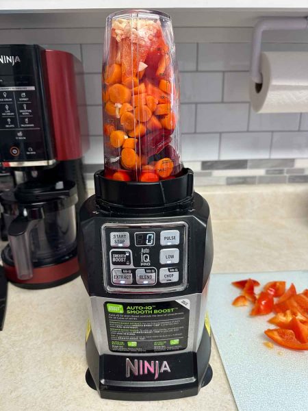 Ingredients for nomato sauce in the blender ready to liquify