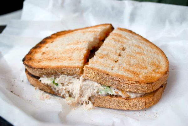 A whitefish salad sandwhich on toasted rye bread