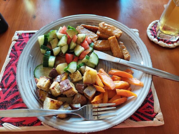 Dinner plate featuring soy maple tempeh with carrots, potatoes, and other veggies. 