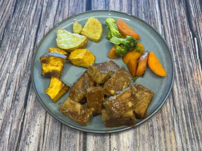 A plate including baked maple Dijon tofu for dinner